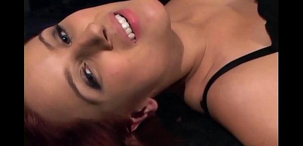  Pretty redhead gives a footjob in sheer stockings